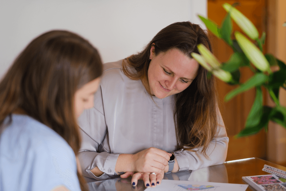 Pauline showcasing design in a consultation meeting with a client